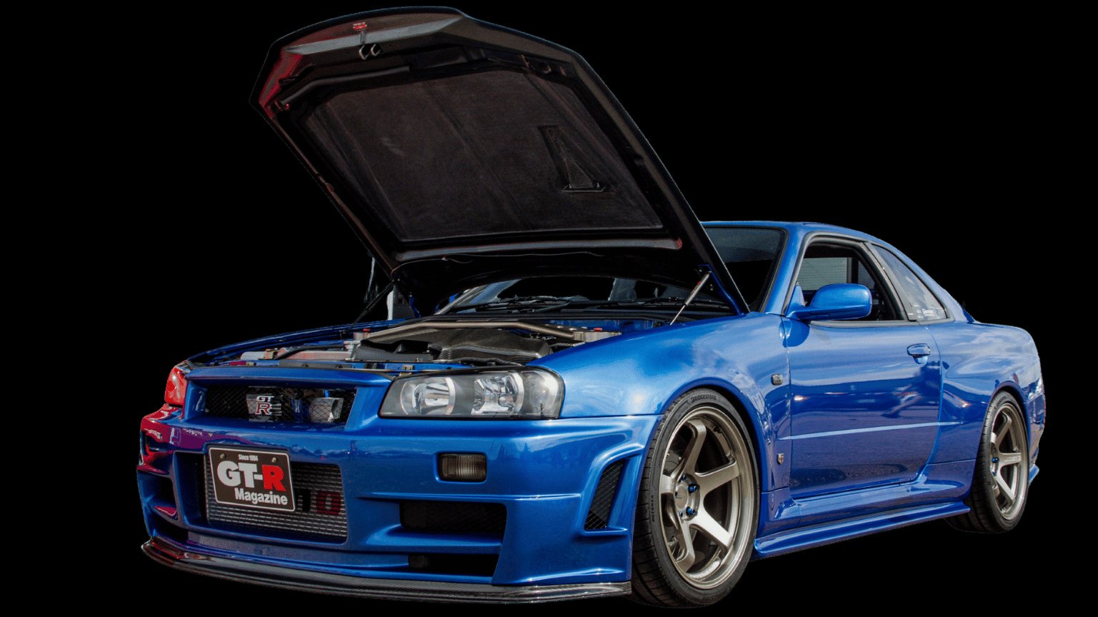Blue Nissan Skyline GT-R R34 with the hood raised